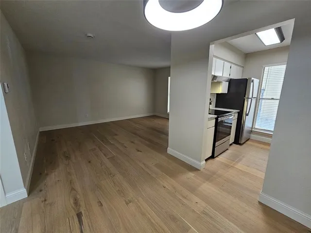 a view of a livingroom with wooden floor