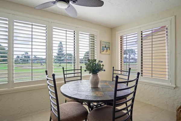 a dining room with furniture and window