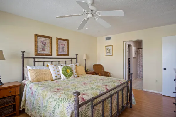 a bedroom with a bed and a table