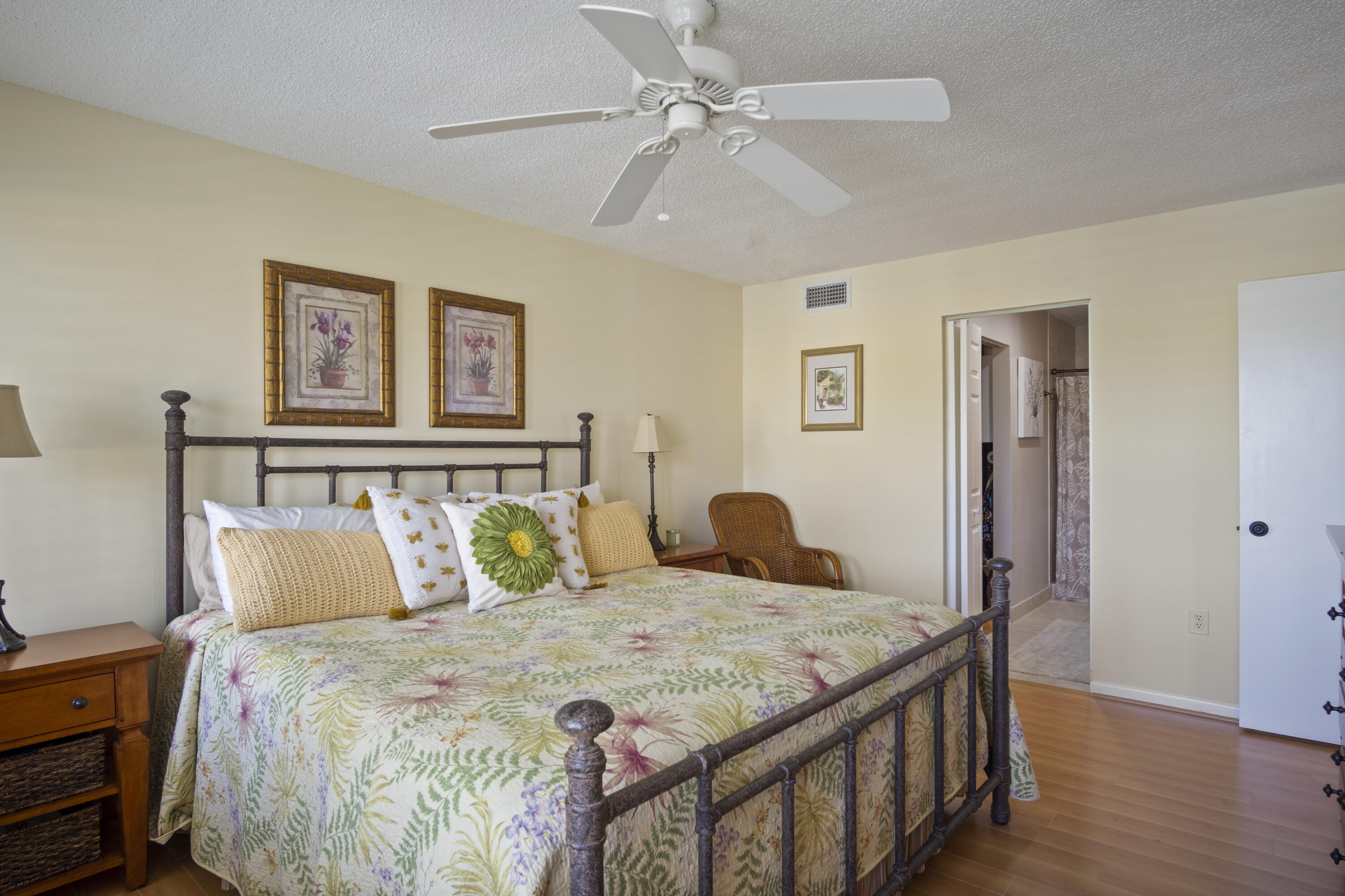 5335 Southeast Miles Grant Road, Unit H 209 Stuart, FL 34997 - Photo 14 of 26 a bedroom with a bed and a table