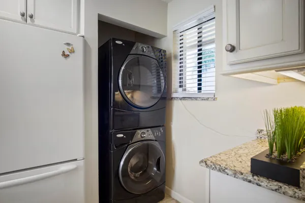 a close view of a utility room with washer and dryer