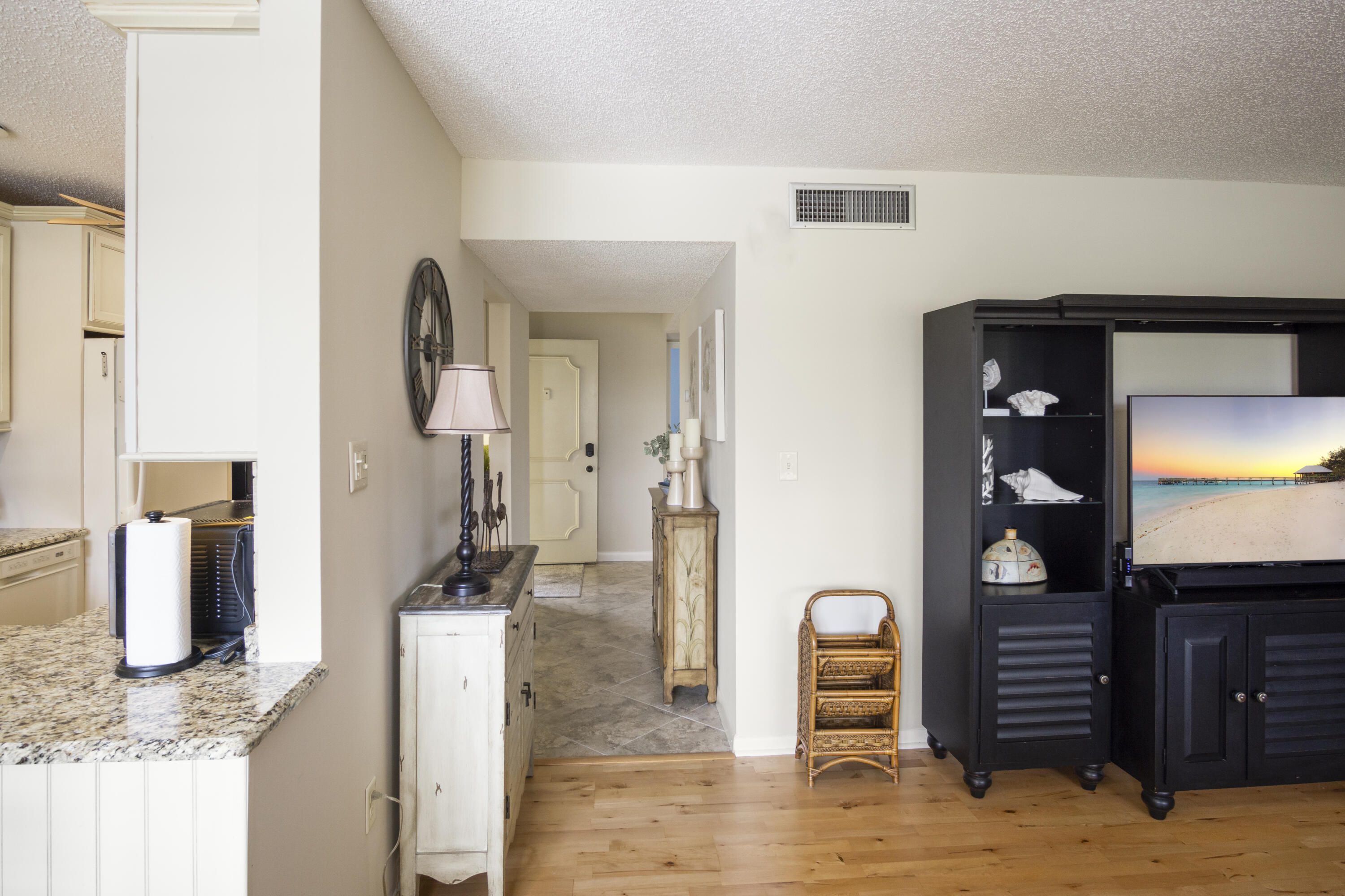 5335 Southeast Miles Grant Road, Unit H 209 Stuart, FL 34997 - Photo 22 of 26 a bathroom with a sink and a mirror