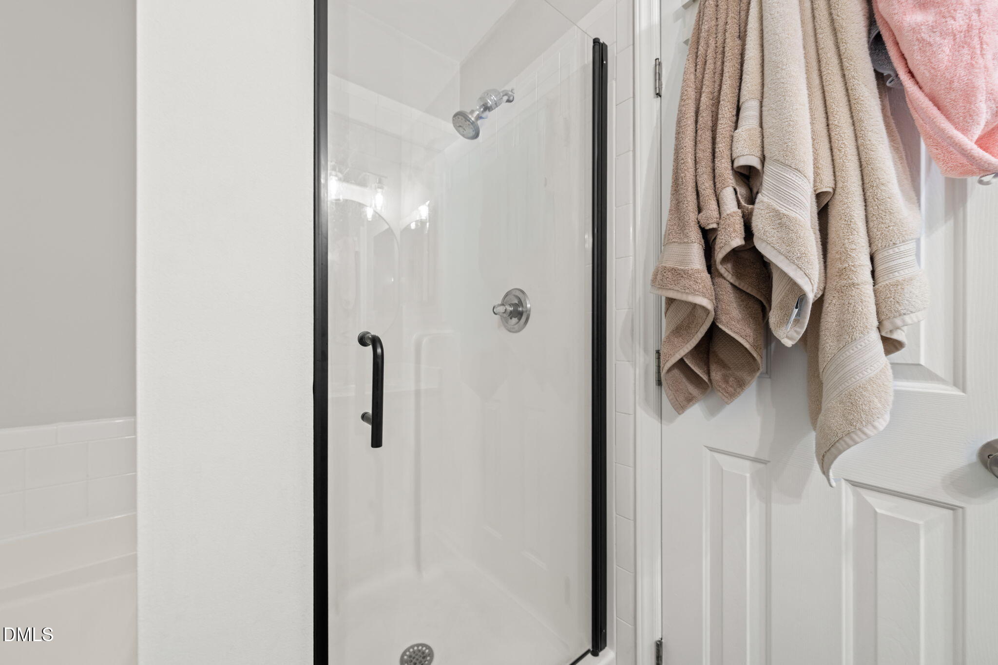 4323 Pine Springs Court Raleigh, NC 27613 - Photo 31 of 38 a bathroom with a shower and a glass door