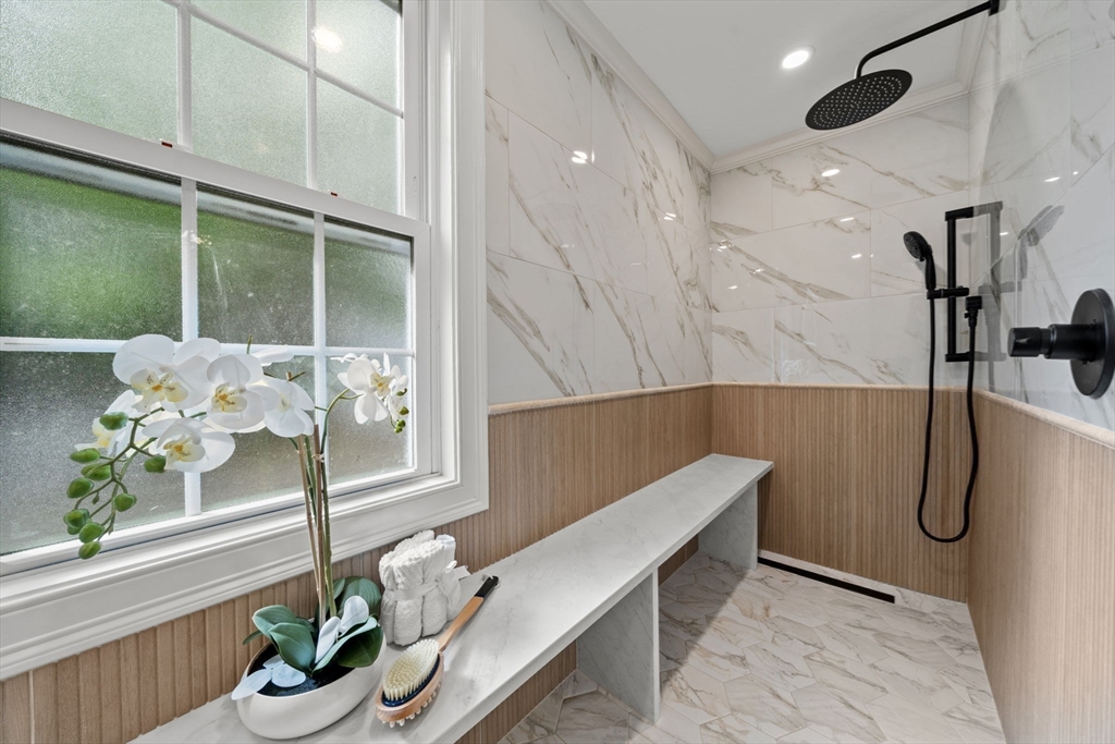 162 High Street, Unit B Danvers, MA 01923 - Photo 18 of 32 a bathroom with a shower curtain and a potted plant