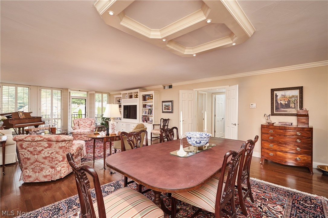2385 Covington Road, Unit 304 Fairlawn, OH 44313 - Photo 9 of 21 Dining space featuring dark wood-style flooring and crown molding
