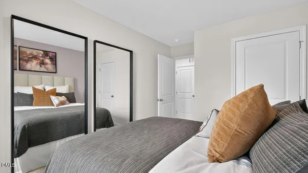 a bedroom with a bed and a couch