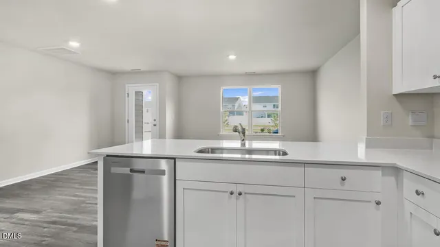 a kitchen with a sink and a window