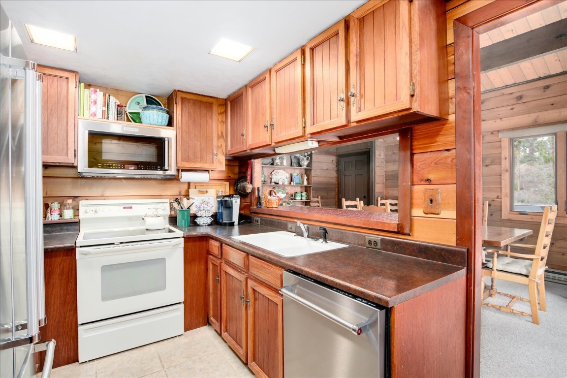 522 Wellington Road Breckenridge, CO 80424 - Photo 15 of 43 a kitchen with stainless steel appliances granite countertop a sink and a stove