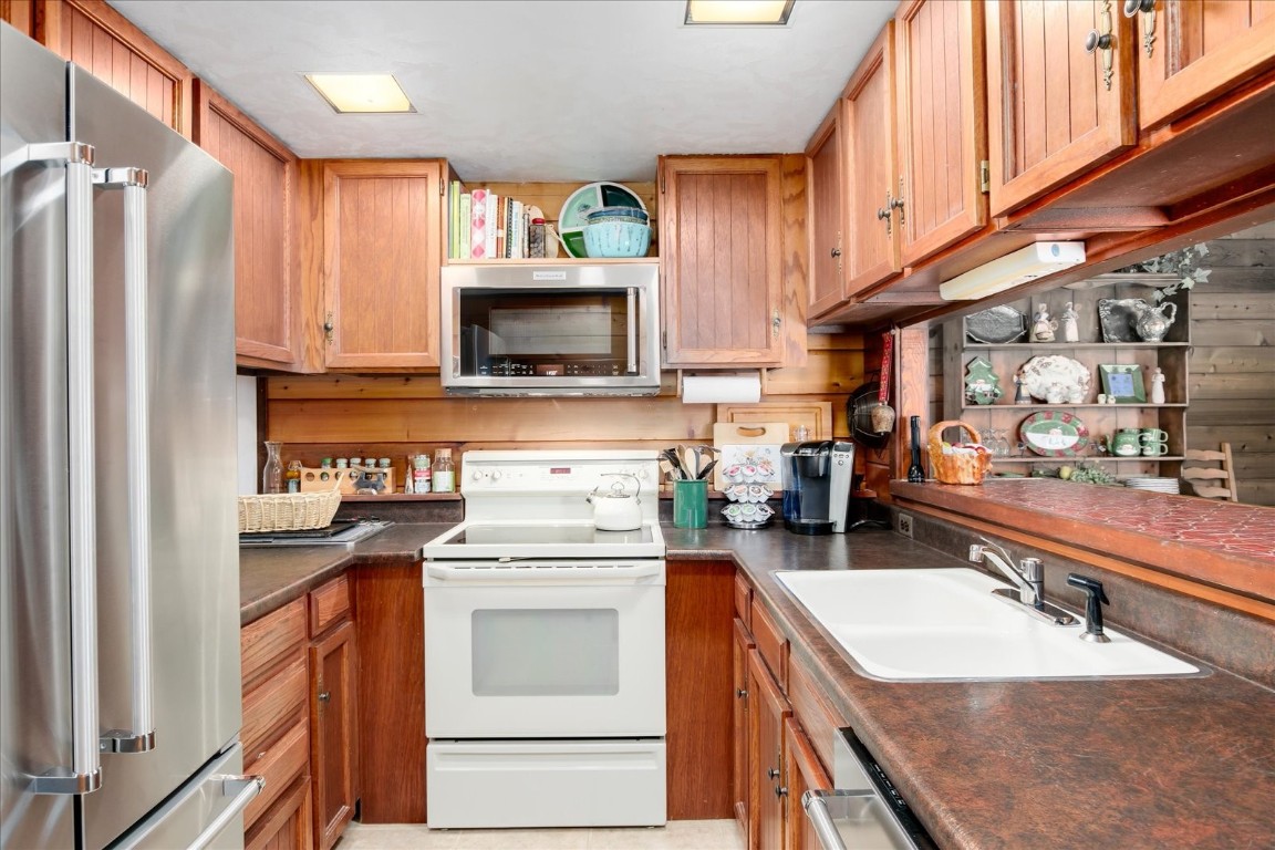 522 Wellington Road Breckenridge, CO 80424 - Photo 16 of 43 a kitchen with a sink stove and refrigerator