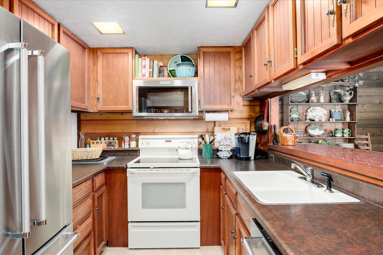 522 Wellington Road Breckenridge, CO 80424 - Photo 16 of 43 a kitchen with a sink stove and refrigerator