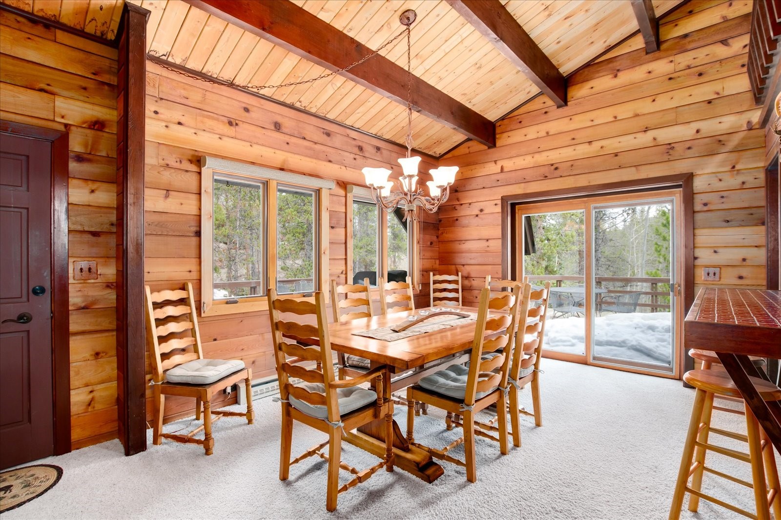 522 Wellington Road Breckenridge, CO 80424 - Photo 20 of 43 a dining room with furniture and floor to ceiling window