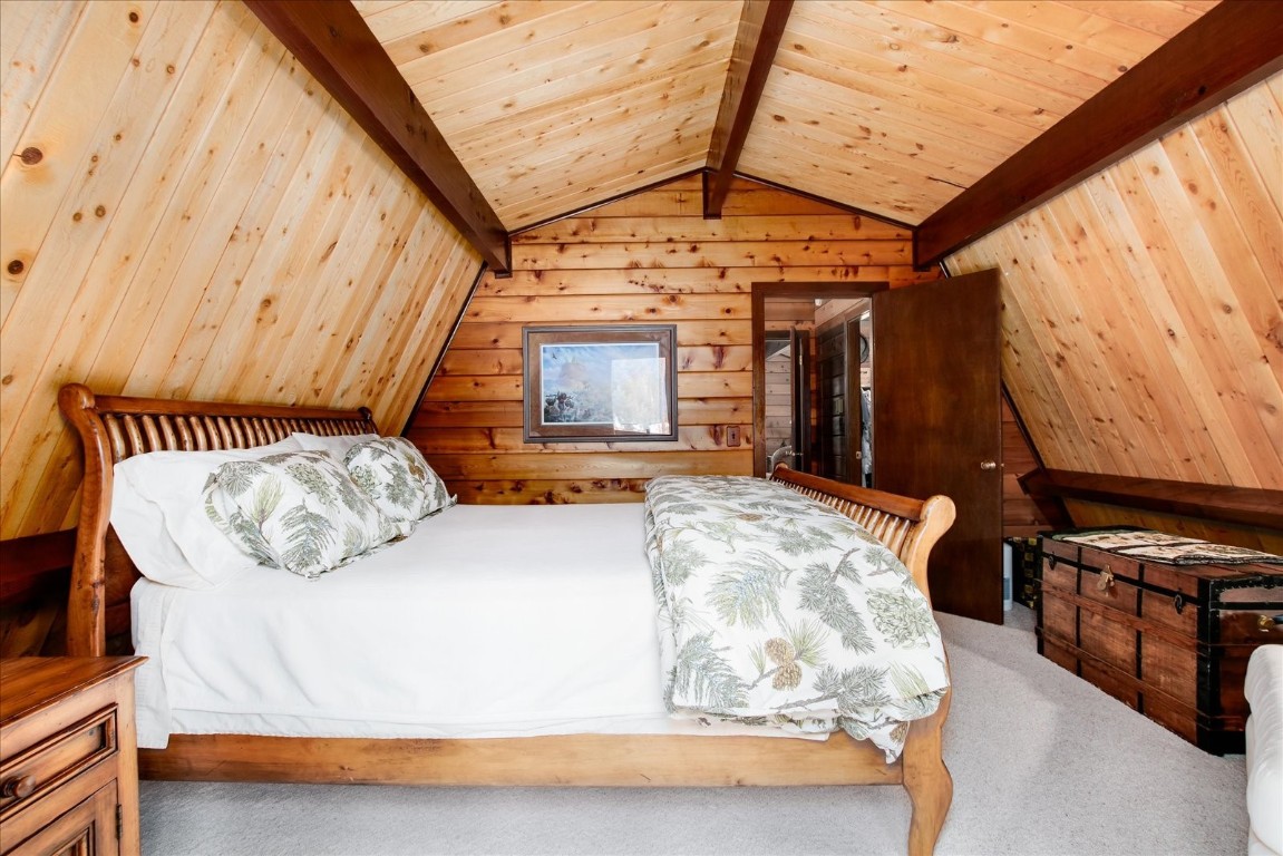 522 Wellington Road Breckenridge, CO 80424 - Photo 26 of 43 a bedroom with bed and a window