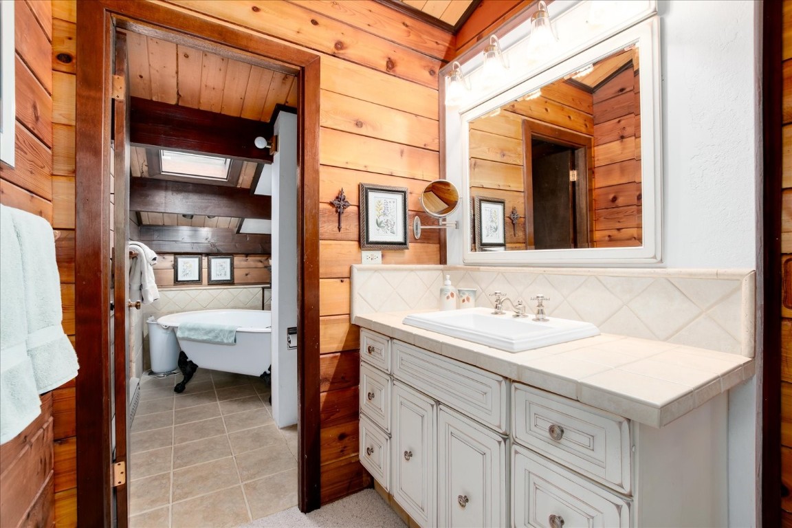 522 Wellington Road Breckenridge, CO 80424 - Photo 27 of 43 a bathroom with a sink and a mirror