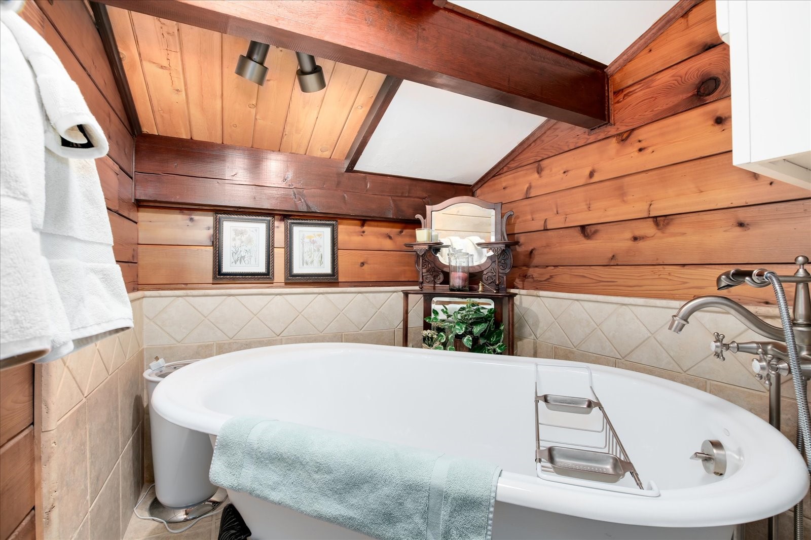 522 Wellington Road Breckenridge, CO 80424 - Photo 28 of 43 a view of a bathtub and door in a room