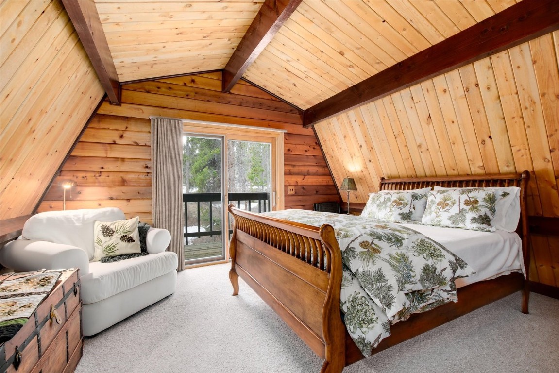 522 Wellington Road Breckenridge, CO 80424 - Photo 3 of 43 a bed sitting in a bedroom next to a window