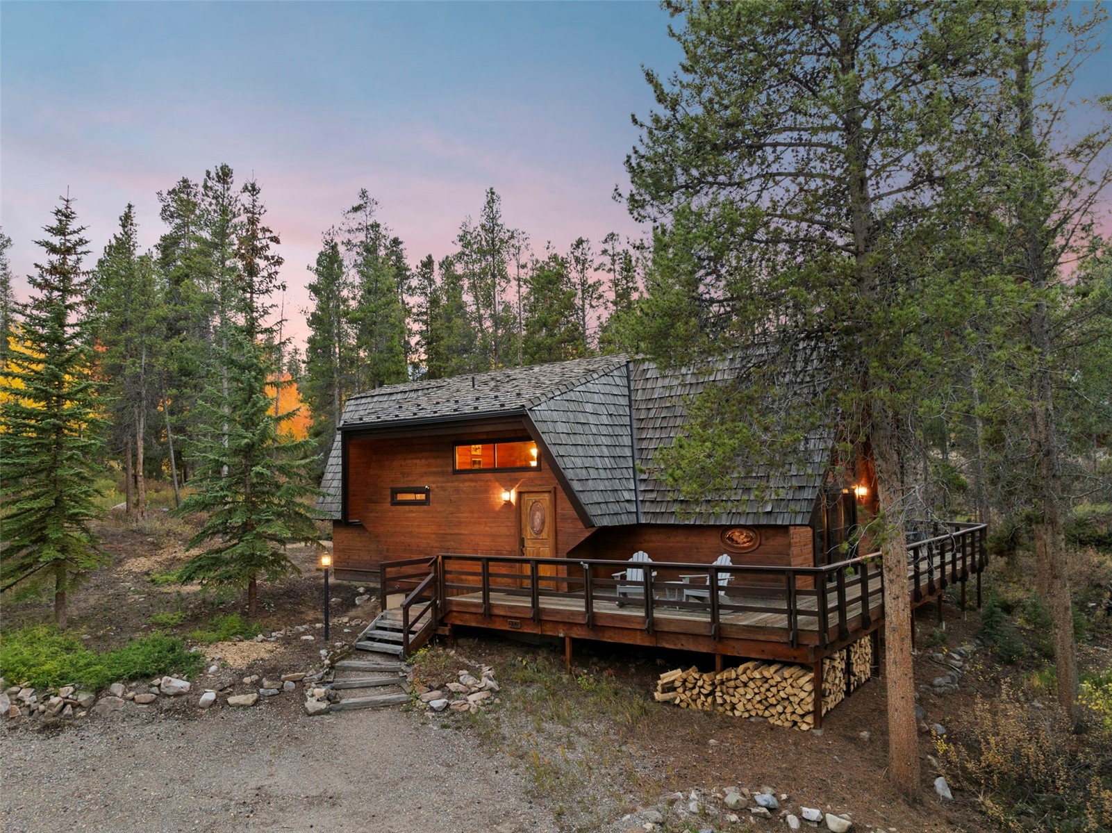 522 Wellington Road Breckenridge, CO 80424 - Photo 41 of 43 a backyard of a house with wooden fence and trees