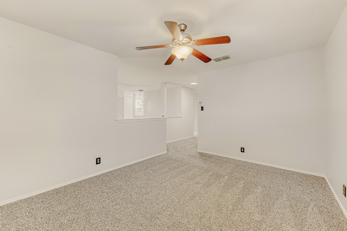 4010 Reeders Drive Austin, TX 78725 - Photo 17 of 26 Carpeted empty room featuring baseboards and ceiling fan