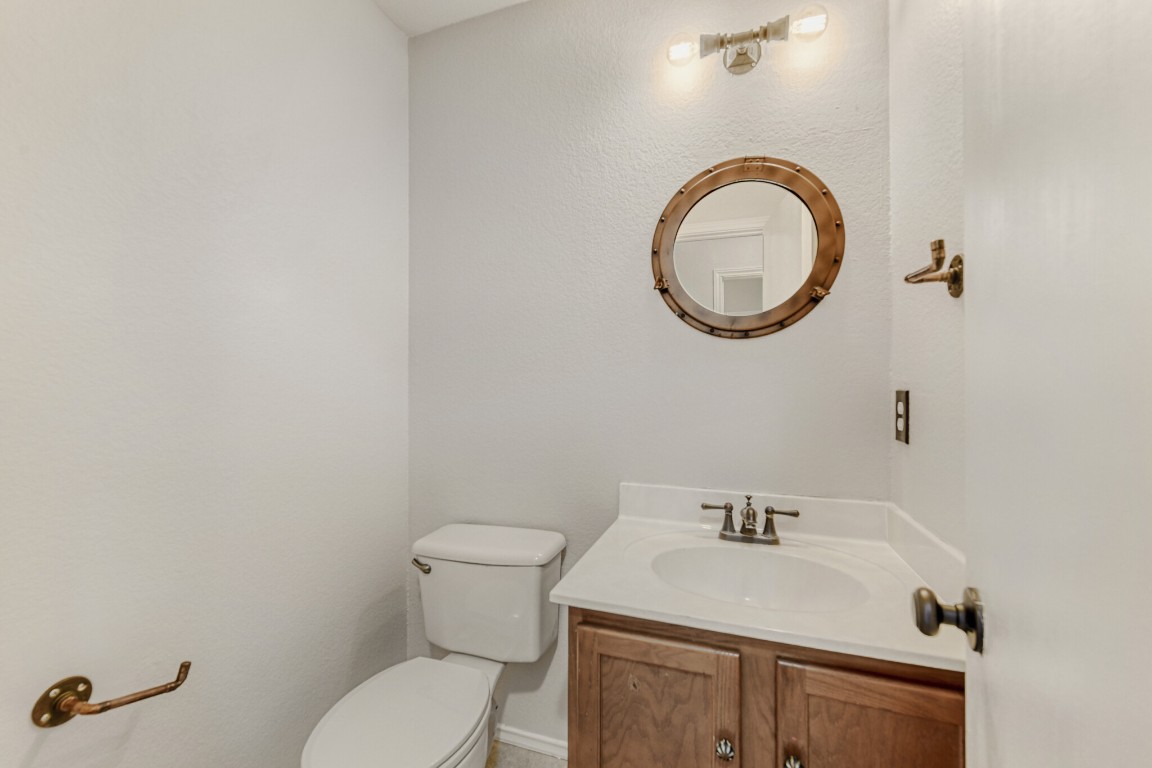 4010 Reeders Drive Austin, TX 78725 - Photo 22 of 26 Half bathroom featuring vanity and toilet