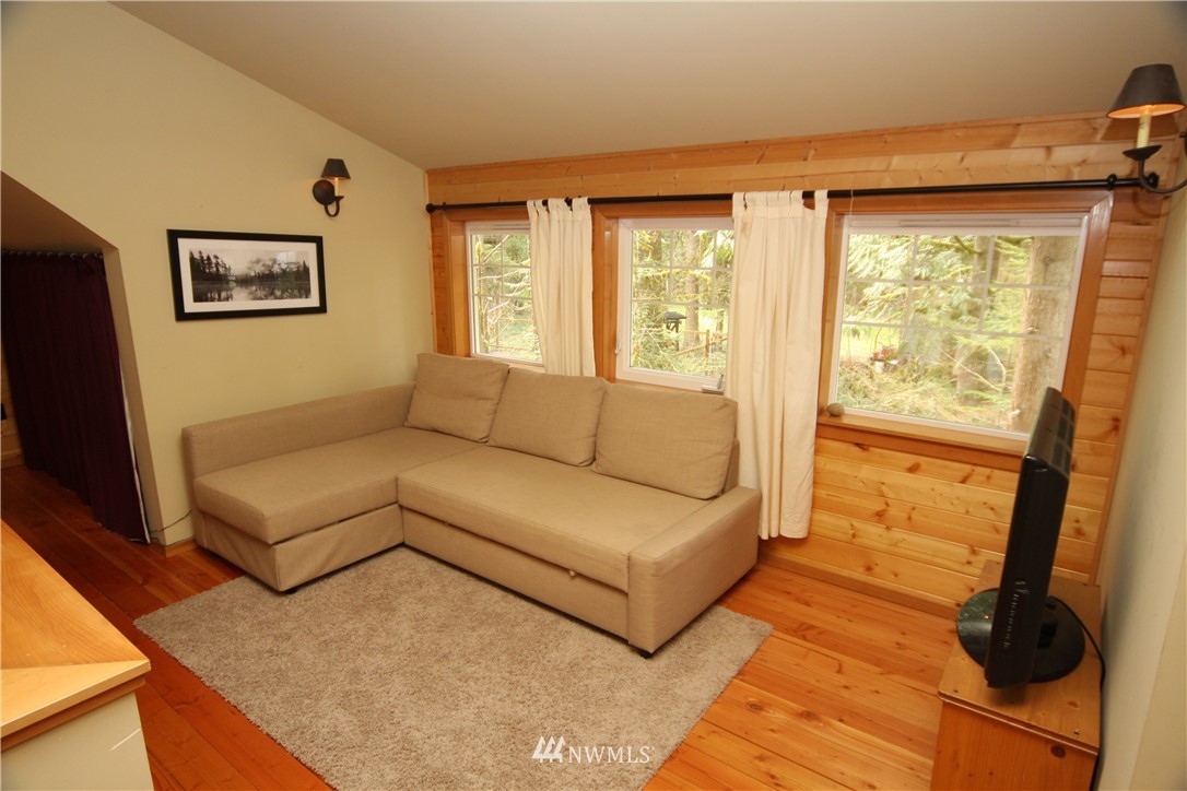 7739 View Ridge Drive Maple Falls, WA 98266 - Photo 13 of 15 a living room with furniture and a flat screen tv