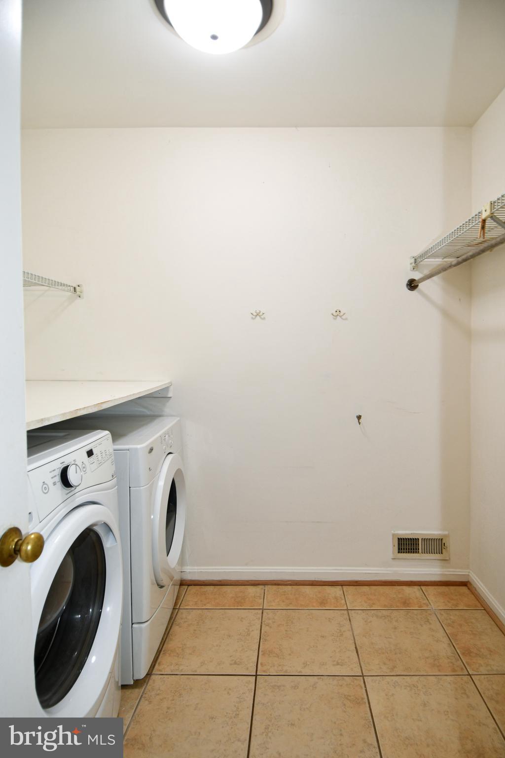 13135 Hutchinson Way Silver Spring, MD 20906 - Photo 13 of 64 LAUNDRY ROOM WITH SHELVES GREAT FOR STORAGE