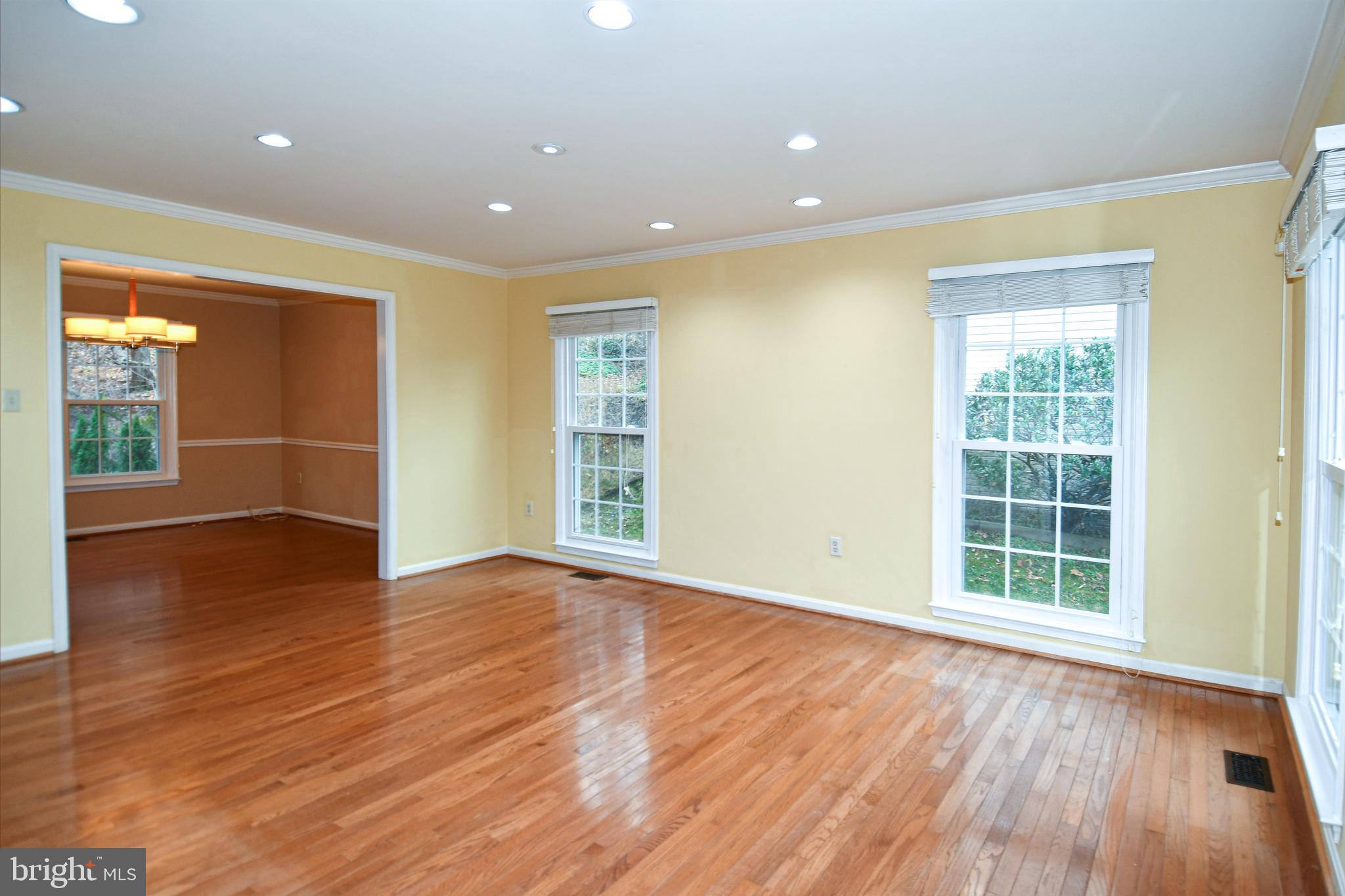 13135 Hutchinson Way Silver Spring, MD 20906 - Photo 25 of 64 an empty room with wooden floor and windows