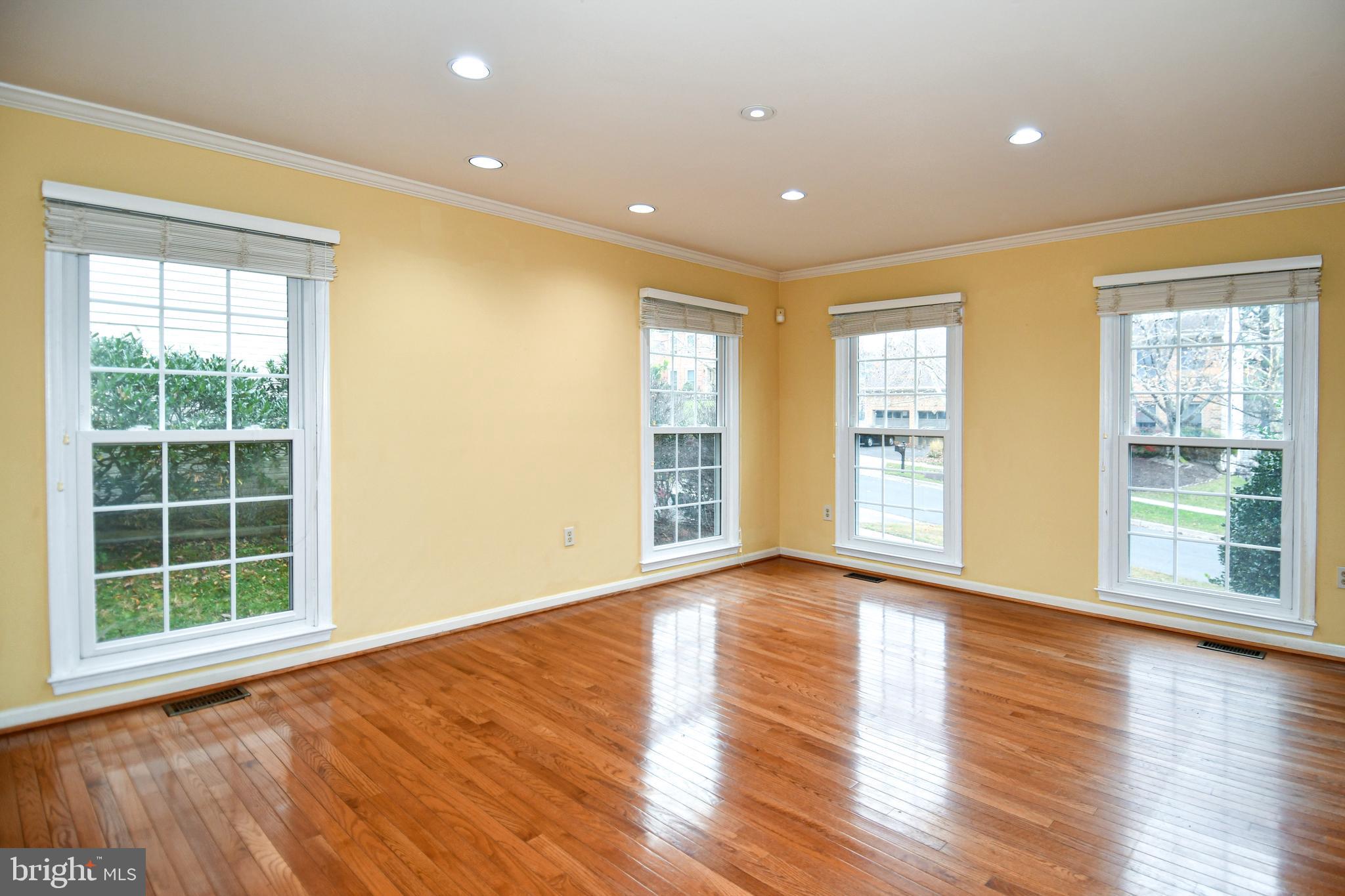 13135 Hutchinson Way Silver Spring, MD 20906 - Photo 27 of 64 a view of an empty room with wooden floor and a window