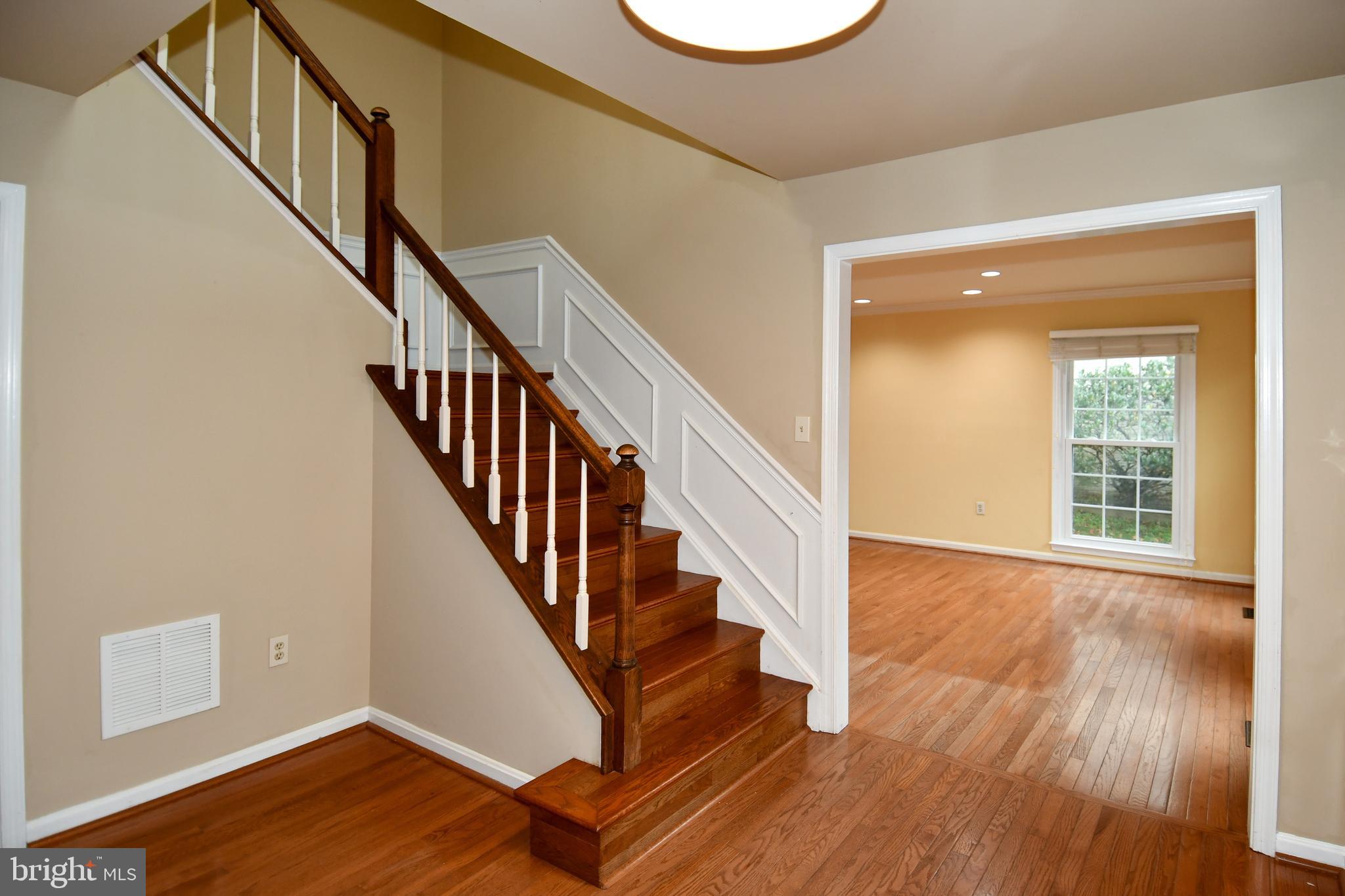 13135 Hutchinson Way Silver Spring, MD 20906 - Photo 28 of 64 a view of an entryway with wooden floor and door