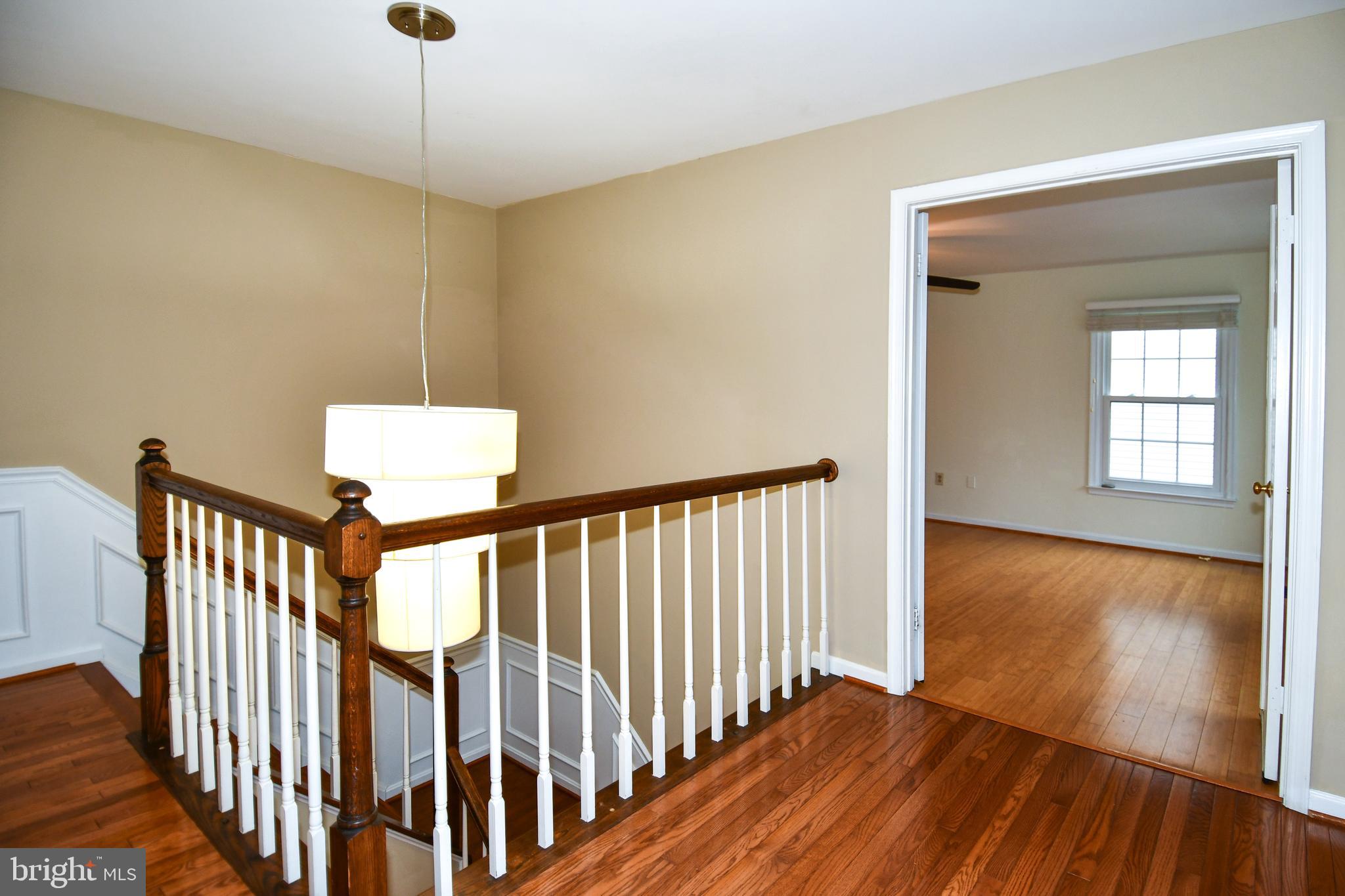 13135 Hutchinson Way Silver Spring, MD 20906 - Photo 29 of 64 a view of a hallway with wooden floor and entryway