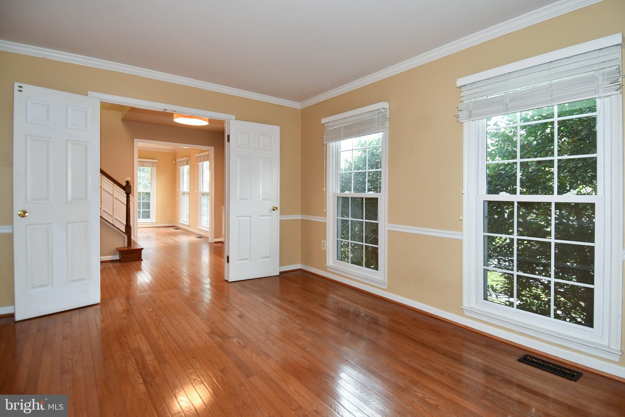 13135 Hutchinson Way Silver Spring, MD 20906 - Photo 5 of 64 a view of empty room with wooden floor and fan