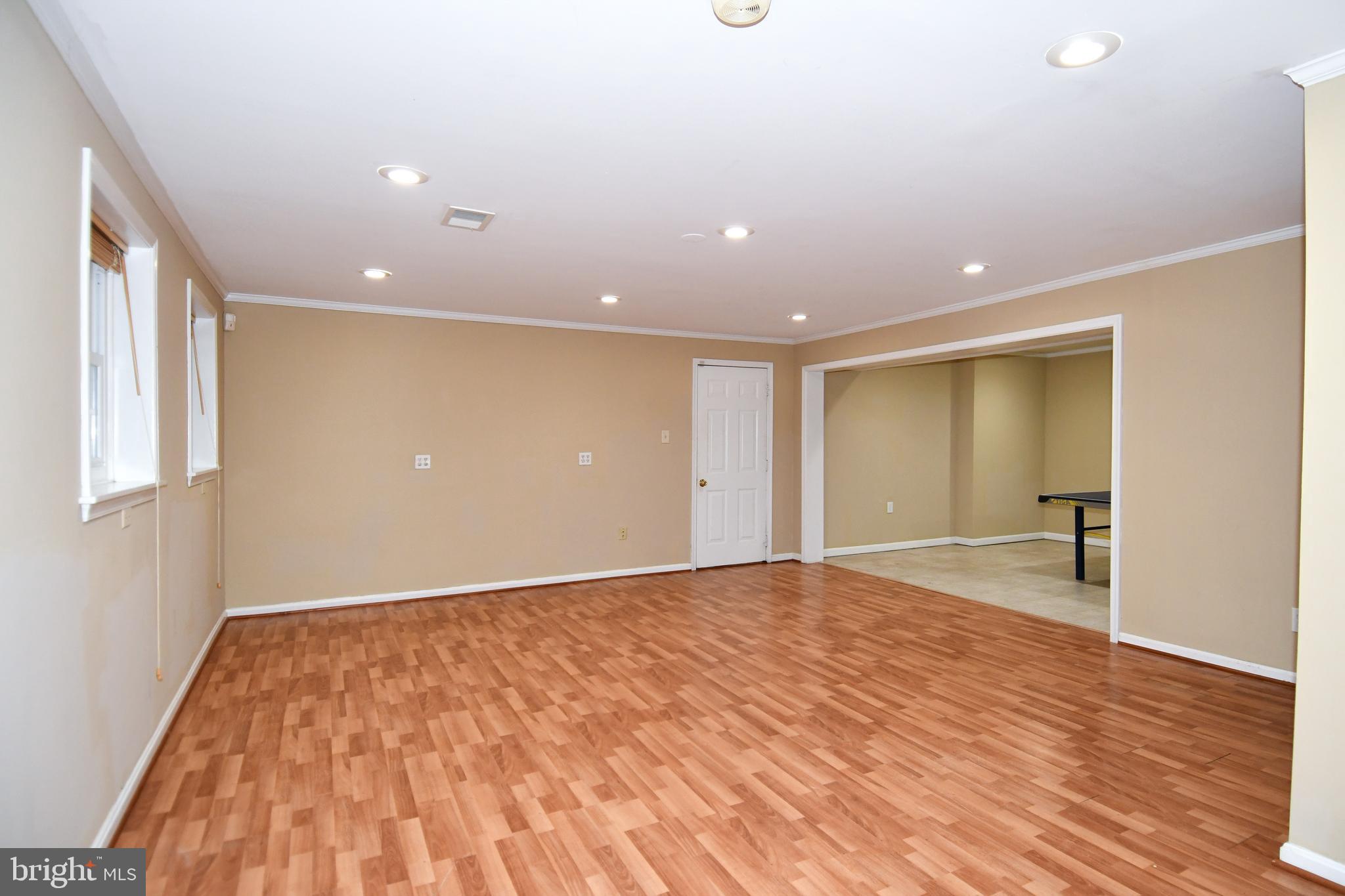 13135 Hutchinson Way Silver Spring, MD 20906 - Photo 51 of 64 a view of an empty room with wooden floor and a window