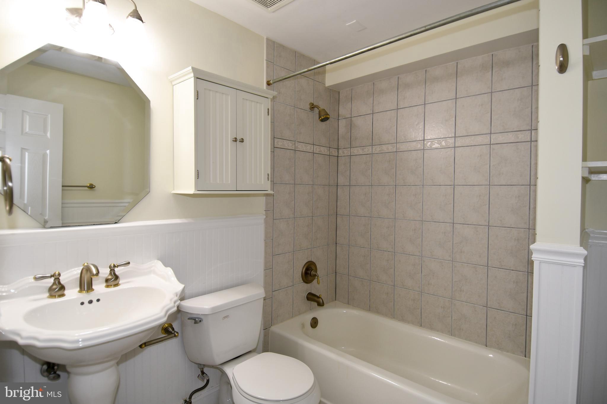 13135 Hutchinson Way Silver Spring, MD 20906 - Photo 55 of 64 a bathroom with a sink toilet and shower