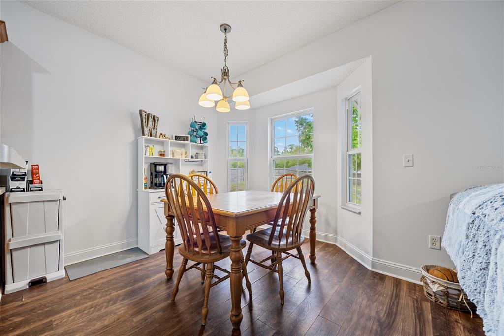 9312 Southwest 152nd Court Lake Butler, FL 32054 - Photo 12 of 37 a view of a dining room with furniture window and wooden floor