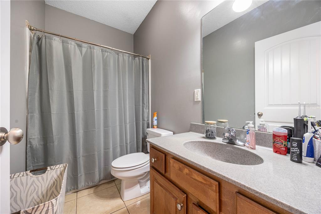 9312 Southwest 152nd Court Lake Butler, FL 32054 - Photo 19 of 37 a bathroom with a sink a toilet and shower