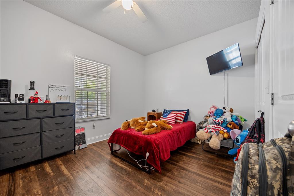 9312 Southwest 152nd Court Lake Butler, FL 32054 - Photo 20 of 37 a bedroom with furniture and a bed