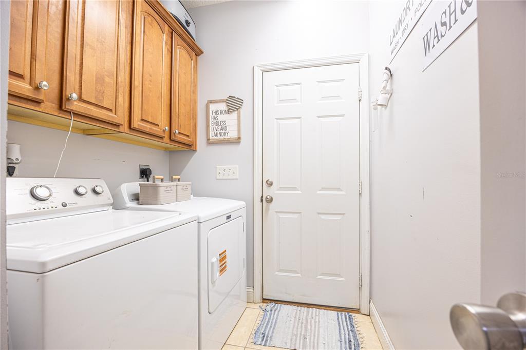 9312 Southwest 152nd Court Lake Butler, FL 32054 - Photo 21 of 37 a view of storage and utility room with washer and dryer