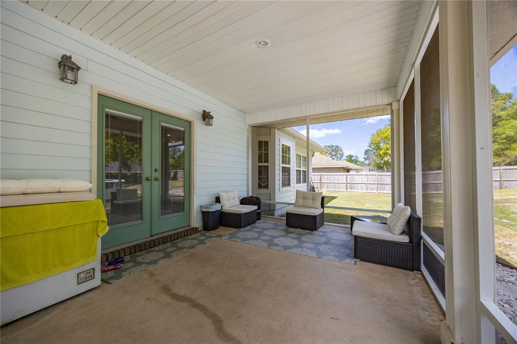 9312 Southwest 152nd Court Lake Butler, FL 32054 - Photo 22 of 37 a living room with furniture and a large window