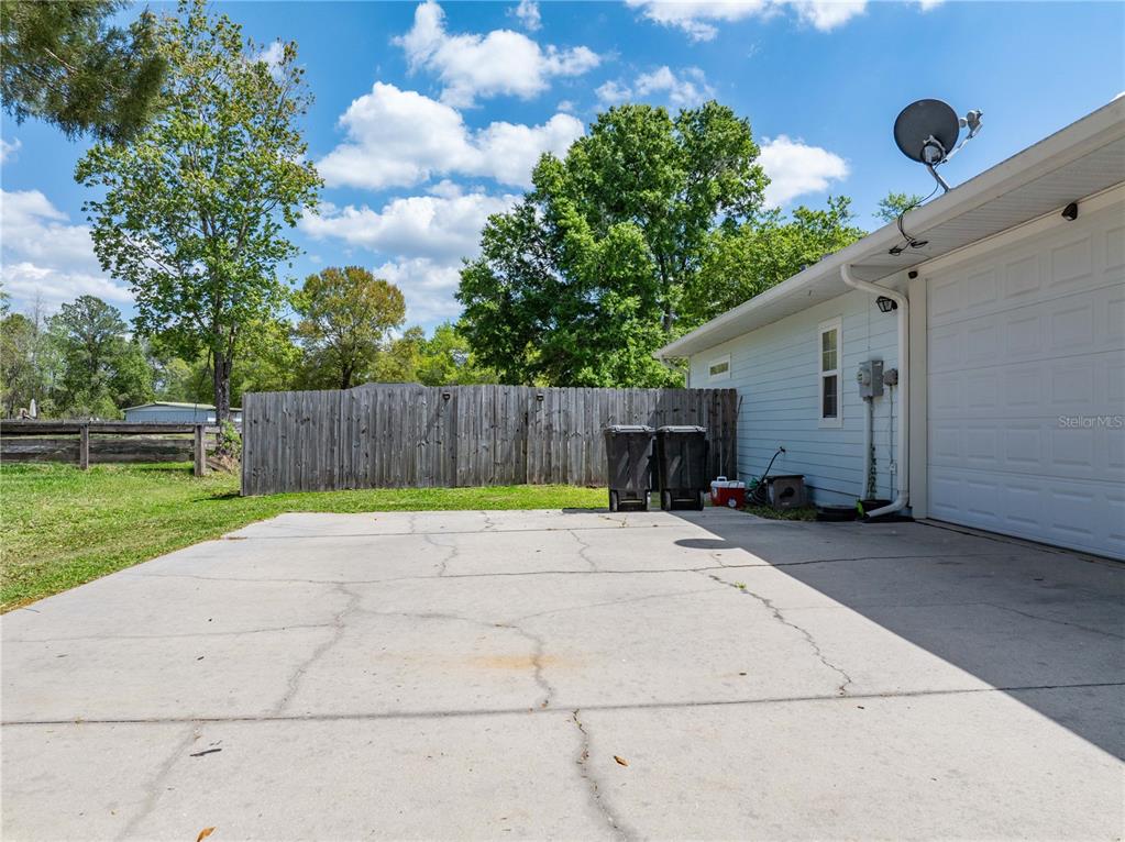 9312 Southwest 152nd Court Lake Butler, FL 32054 - Photo 26 of 37 a view of backyard with trampoline