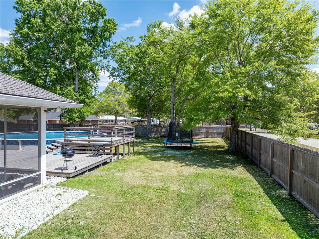 9312 Southwest 152nd Court Lake Butler, FL 32054 - Photo 27 of 37 a view of a backyard with swimming pool