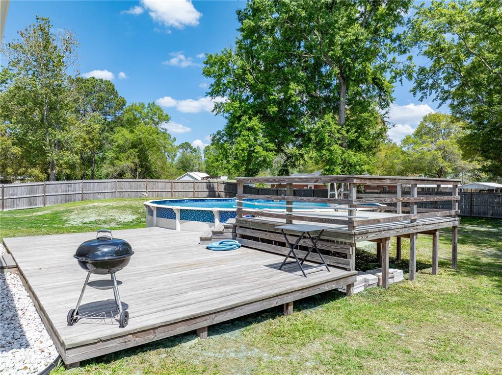 9312 Southwest 152nd Court Lake Butler, FL 32054 - Photo 28 of 37 a view of a patio with chairs and a table