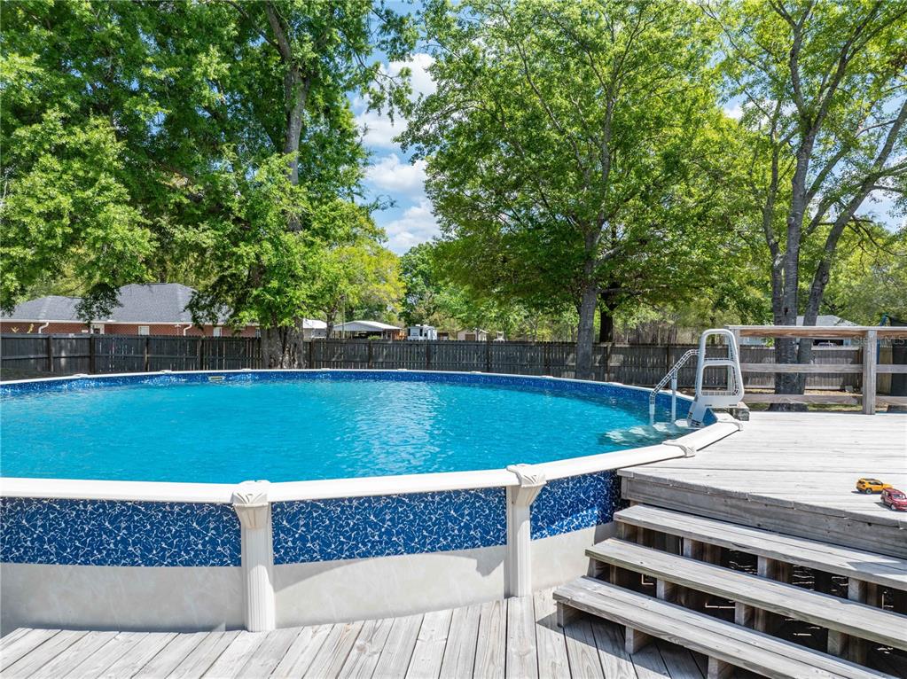 9312 Southwest 152nd Court Lake Butler, FL 32054 - Photo 29 of 37 a view of a backyard with swimming pool