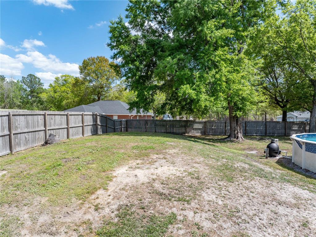 9312 Southwest 152nd Court Lake Butler, FL 32054 - Photo 31 of 37 a view of a backyard with large trees