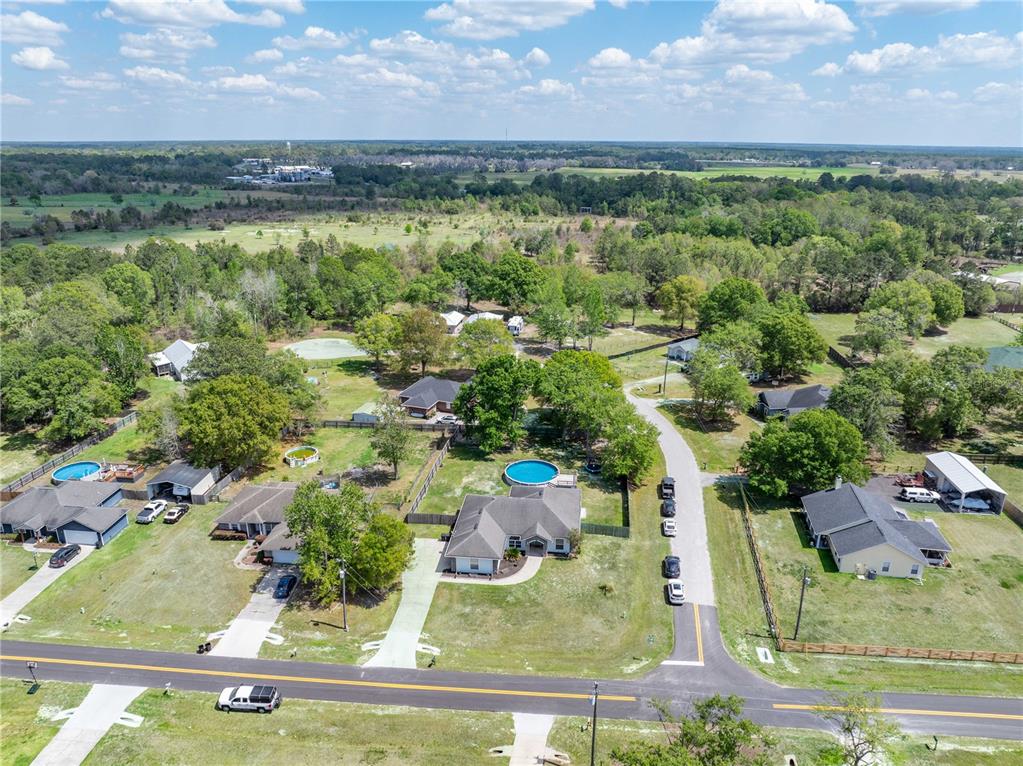 9312 Southwest 152nd Court Lake Butler, FL 32054 - Photo 35 of 37 an aerial view of residential houses with outdoor space and city view