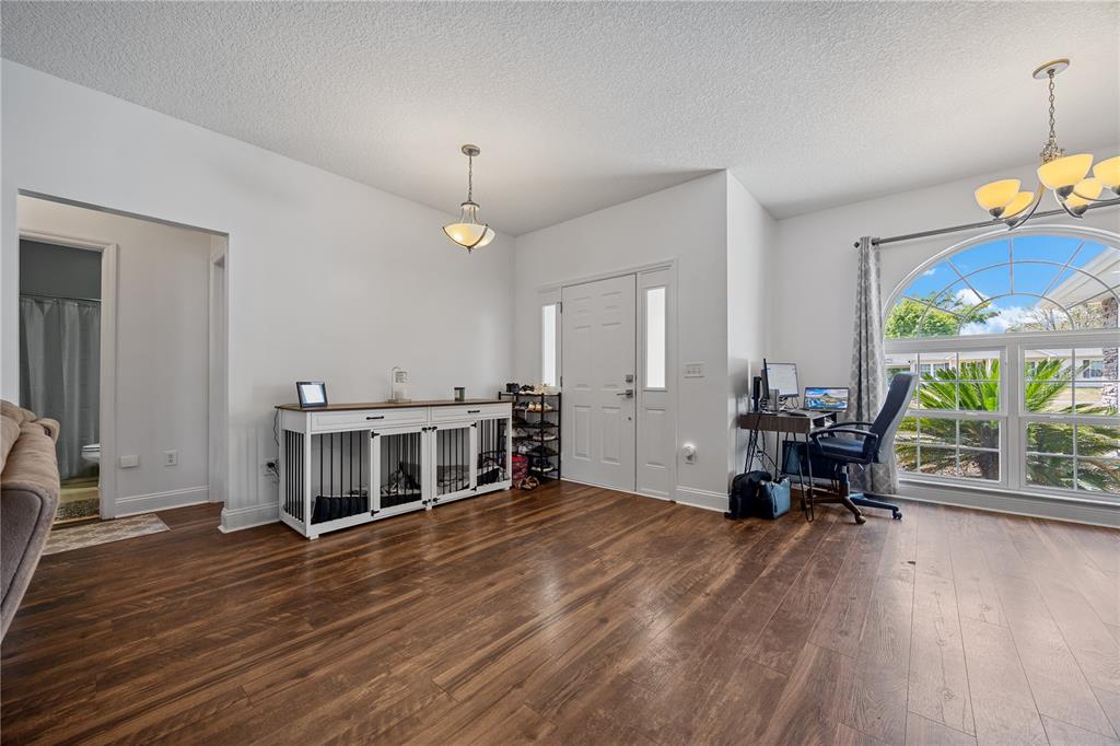 9312 Southwest 152nd Court Lake Butler, FL 32054 - Photo 5 of 37 a view of a livingroom with furniture window and wooden floor