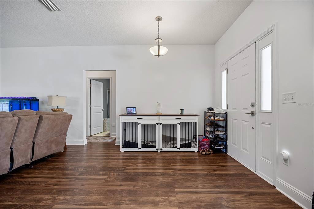 9312 Southwest 152nd Court Lake Butler, FL 32054 - Photo 6 of 37 a view of a living room with furniture and a view of bedroom
