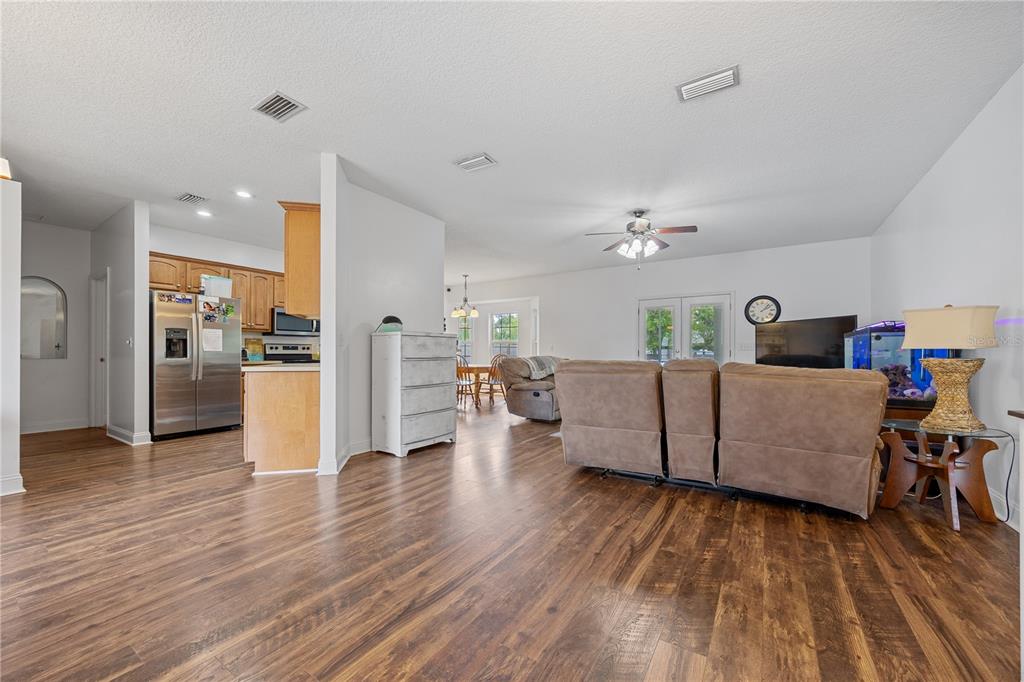 9312 Southwest 152nd Court Lake Butler, FL 32054 - Photo 7 of 37 a living room with furniture and a wooden floor