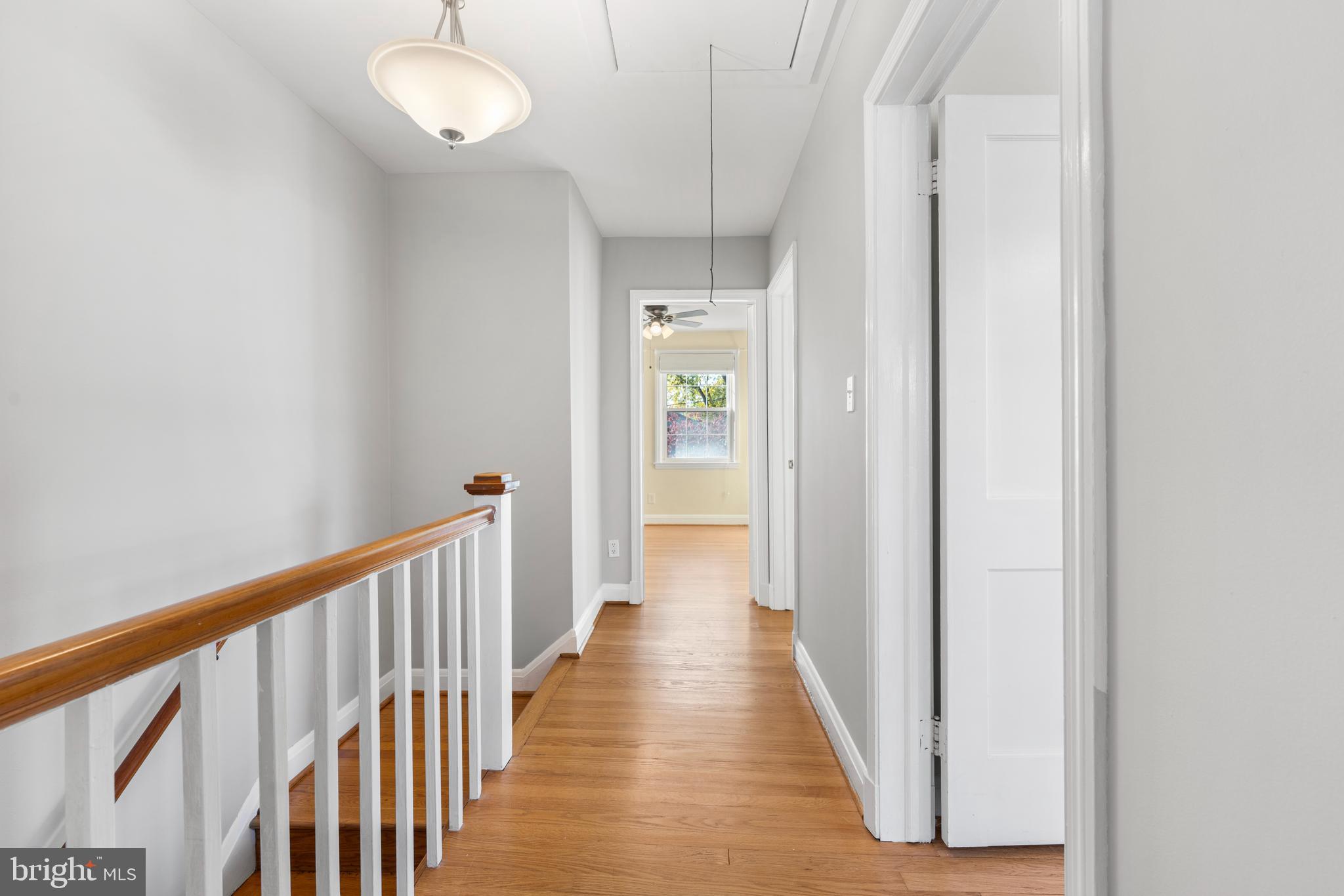 101 Regester Avenue Baltimore, MD 21212 - Photo 12 of 19 a view of a hallway with wooden floor and staircase