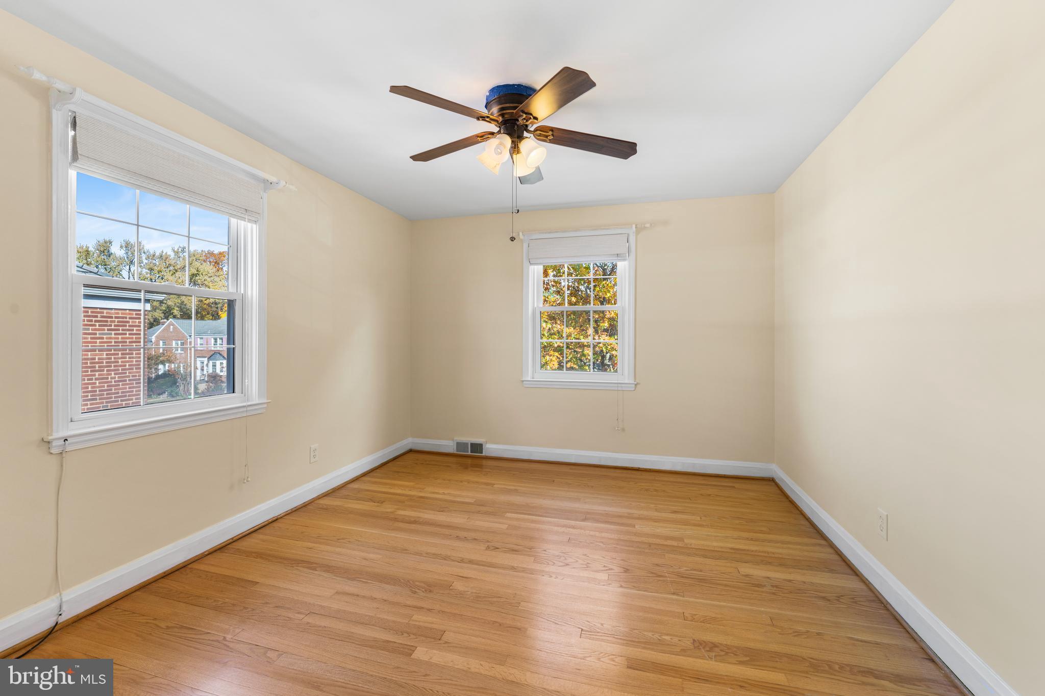 101 Regester Avenue Baltimore, MD 21212 - Photo 14 of 19 wooden floor in an empty room with a window