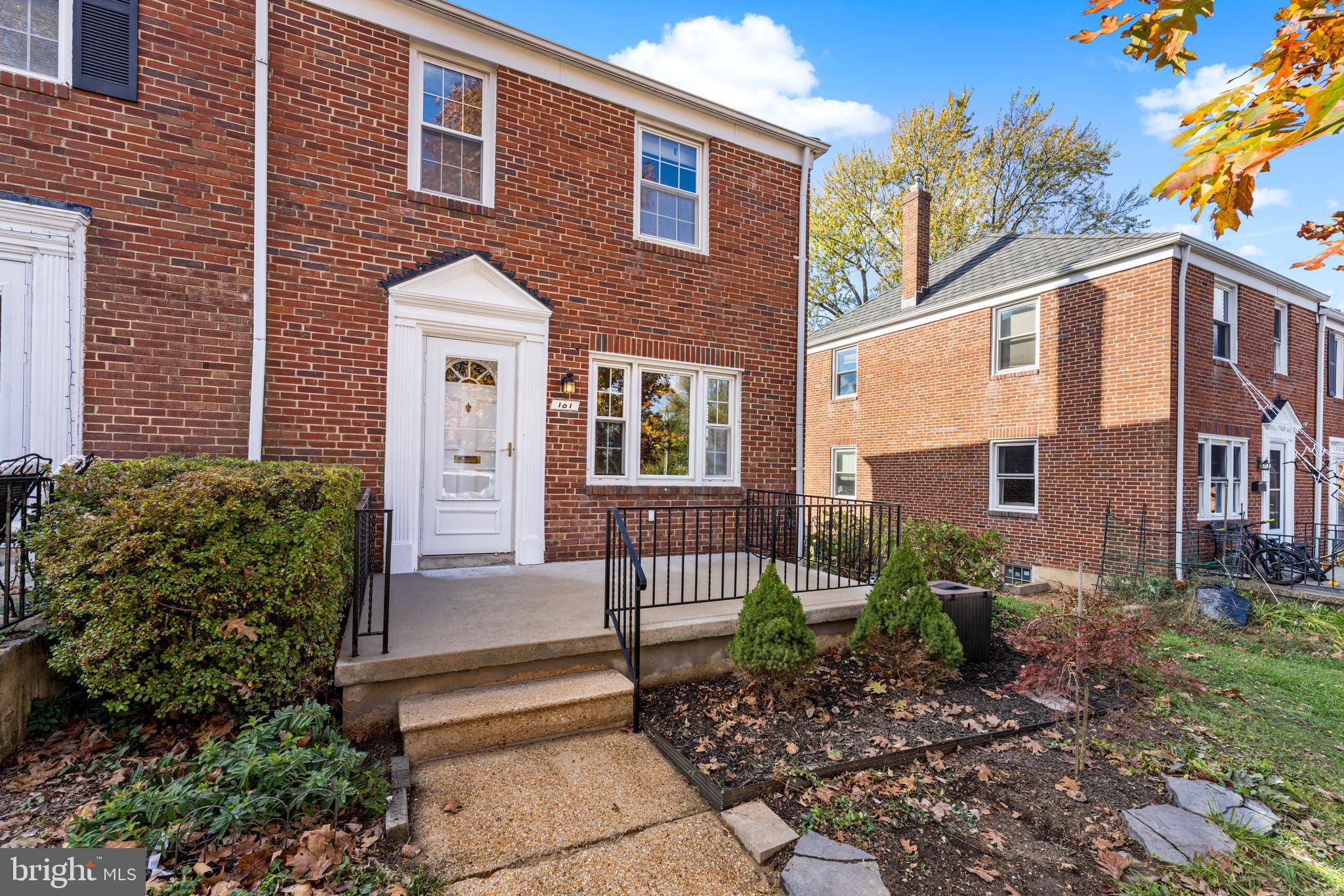 101 Regester Avenue Baltimore, MD 21212 - Photo 2 of 19 a front view of a house with a garden