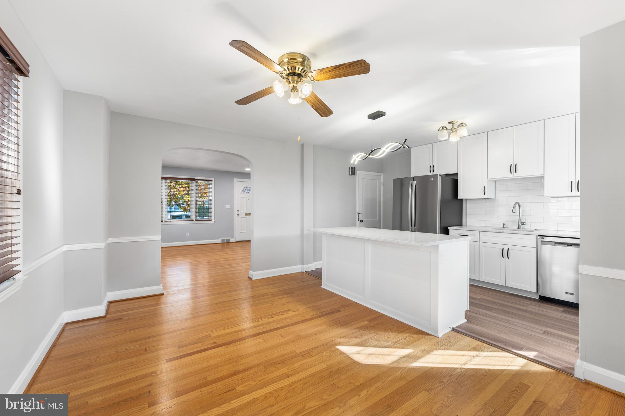 101 Regester Avenue Baltimore, MD 21212 - Photo 6 of 19 a view of kitchen with cabinets appliances and wooden floor