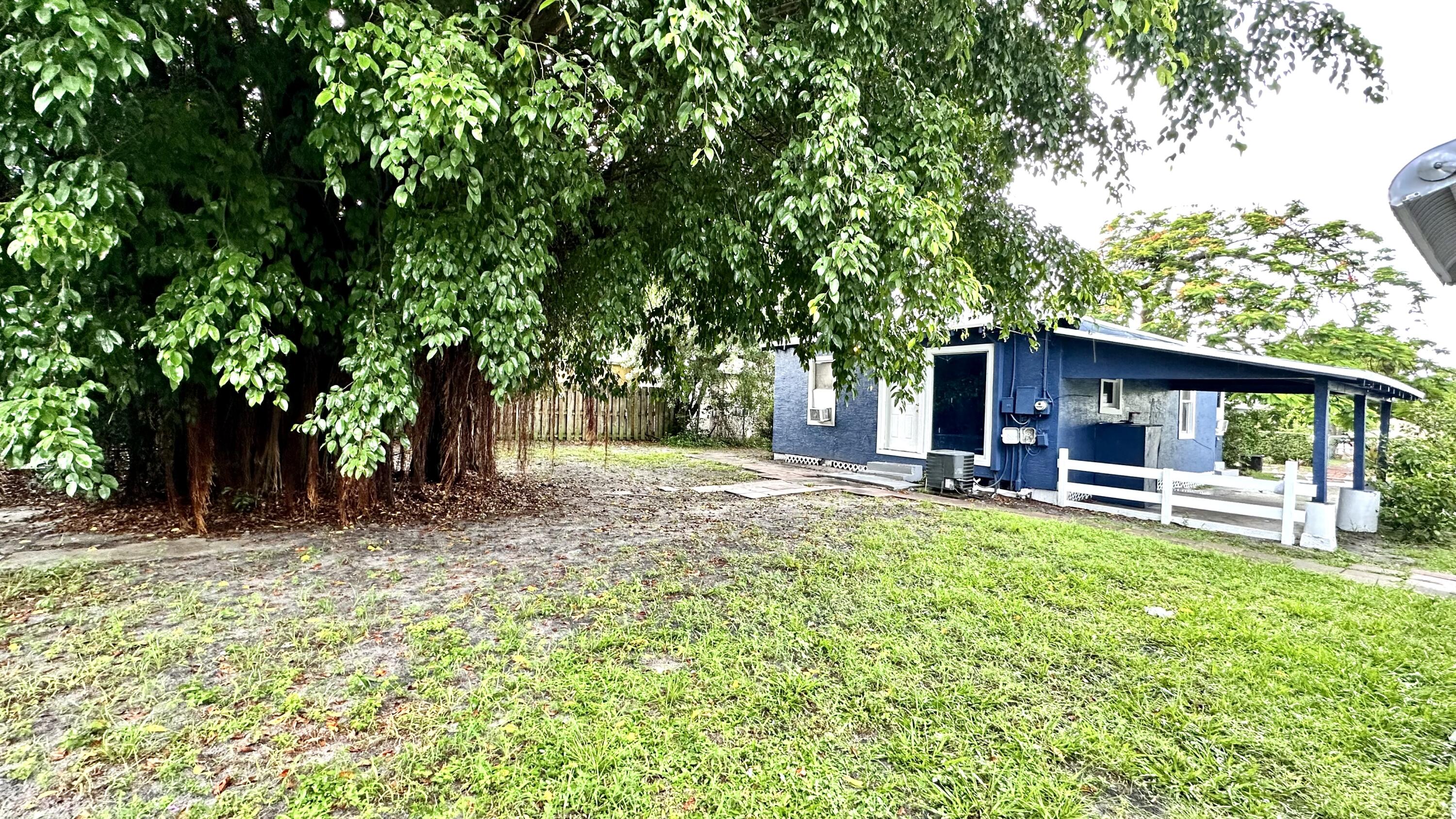 3804 Miller Avenue, Unit C West Palm Beach, FL 33405 - Photo 8 of 10 a view of a house with backyard porch and sitting area
